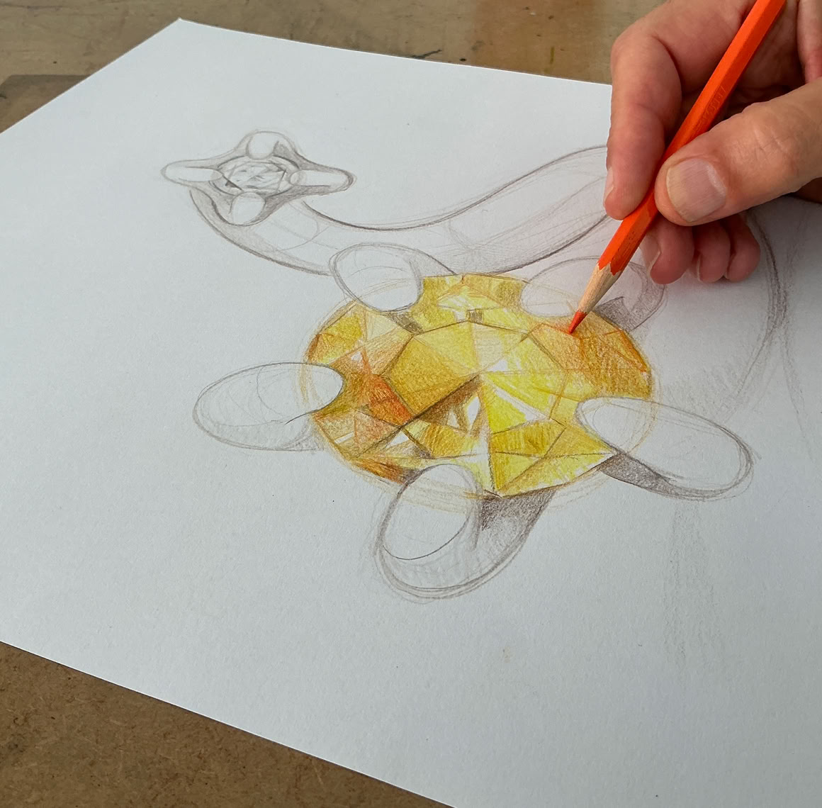 Bijou en forme de fleur avec une tige violette, une fleur rouge et une verte.